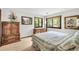 Cozy bedroom featuring nature views, wood furniture, and plush bedding at 3152 Sycamore Ln, Marietta, GA 30066
