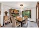 Elegant dining room with wood table, tile flooring, and built-in cabinetry at 3152 Sycamore Ln, Marietta, GA 30066