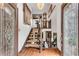 Stunning foyer with wood floors, glass-accented doors, and elegant staircase at 3152 Sycamore Ln, Marietta, GA 30066
