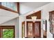 Bright foyer featuring vaulted ceilings, a chandelier, and decorative glass doors at 3152 Sycamore Ln, Marietta, GA 30066