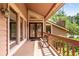 Inviting front porch with double doors, large windows, and a cozy bench at 3152 Sycamore Ln, Marietta, GA 30066