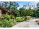 Well-manicured front yard featuring lush greenery and mature trees at 3152 Sycamore Ln, Marietta, GA 30066