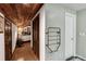 Hallway featuring wooden accents, a heater and hardwood floors at 3152 Sycamore Ln, Marietta, GA 30066