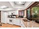 Modern kitchen featuring white cabinets, stainless steel sink, and well-lit countertops at 3152 Sycamore Ln, Marietta, GA 30066