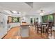 Bright kitchen with white cabinets, granite countertops, and adjacent breakfast area at 3152 Sycamore Ln, Marietta, GA 30066