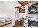 Convenient laundry area featuring stackable washer/dryer and tiled countertop at 3152 Sycamore Ln, Marietta, GA 30066