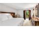 The primary bedroom features neutral paint, carpet, and access to the balcony at 3152 Sycamore Ln, Marietta, GA 30066