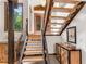 Unique wooden staircase with open treads and an adjacent window at 3152 Sycamore Ln, Marietta, GA 30066