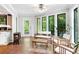 Bright sunroom with tile flooring, wood furnishings, and abundant natural light at 3152 Sycamore Ln, Marietta, GA 30066