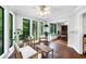 Sunroom showcasing ample seating, natural light and view to breakfast nook at 3152 Sycamore Ln, Marietta, GA 30066