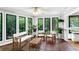 Inviting sunroom with large windows, comfortable seating, and lush greenery views at 3152 Sycamore Ln, Marietta, GA 30066