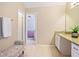 Bathroom featuring a granite vanity, with an adjacent view of the main bedroom at 5841 Cobalt Dr, Powder Springs, GA 30127