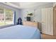 Comfortable bedroom with TV and built-in shelving at 5841 Cobalt Dr, Powder Springs, GA 30127