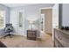 Neutral bedroom features a gaming chair, bedside table, and closet with mirrored door at 5841 Cobalt Dr, Powder Springs, GA 30127