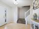 Inviting entryway with hardwood floors and staircase that leads to the upper level at 5841 Cobalt Dr, Powder Springs, GA 30127