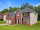 This attractive home has a brick facade, a two-car garage, and a well-kept lawn at 5841 Cobalt Dr, Powder Springs, GA 30127
