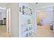 Neutral hallway with lovely decor leading to the kitchen and living room at 5841 Cobalt Dr, Powder Springs, GA 30127