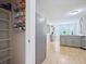 Walk-in pantry leading into kitchen featuring stainless steel appliances and breakfast nook at 5841 Cobalt Dr, Powder Springs, GA 30127
