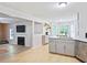Open concept kitchen with barstool seating, stainless steel appliances and view into the living room at 5841 Cobalt Dr, Powder Springs, GA 30127