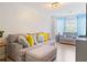 Comfortable living room featuring laminate wood flooring, couch, and window at 5841 Cobalt Dr, Powder Springs, GA 30127