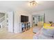 Spacious living room featuring laminate wood flooring with views of the bedroom at 5841 Cobalt Dr, Powder Springs, GA 30127
