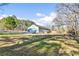 Expansive backyard with a mix of lawn and wooded area and a detached garage at 900 Stone Lea Trce, Oxford, GA 30054