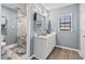 Stylish bathroom with a double sink vanity, modern fixtures, and a marble shower at 900 Stone Lea Trce, Oxford, GA 30054