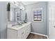 Bright bathroom with a double sink vanity, modern fixtures, and a window at 900 Stone Lea Trce, Oxford, GA 30054
