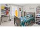 Cozy bedroom featuring a full-size bed, a wooden floor, and whimsical dinosaur-themed decor at 900 Stone Lea Trce, Oxford, GA 30054