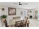 Bright dining area with chandelier, sliding glass doors to outdoor patio, and direct kitchen access at 900 Stone Lea Trce, Oxford, GA 30054