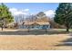 Inviting one-story home with mature trees and a spacious front yard at 900 Stone Lea Trce, Oxford, GA 30054