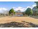 Charming one-story home with a spacious front yard, mature trees, and a long driveway at 900 Stone Lea Trce, Oxford, GA 30054
