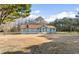Cozy one-story home with a large front yard and a mix of mature trees at 900 Stone Lea Trce, Oxford, GA 30054