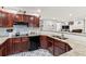 Stylish kitchen featuring granite countertops, stainless steel appliances, and custom cabinetry at 900 Stone Lea Trce, Oxford, GA 30054