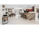 Open-concept living area features hard surface floors, kitchen bar, and dining table at 900 Stone Lea Trce, Oxford, GA 30054