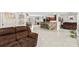 Inviting living room showcasing an open floorplan with hard surface flooring and neutral paint colors at 900 Stone Lea Trce, Oxford, GA 30054