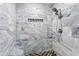 This walk-in shower is tiled with marble and features a stone floor and a recessed shelf at 900 Stone Lea Trce, Oxford, GA 30054