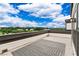 Cozy rooftop patio with outdoor rug and beautiful views of the surrounding neighborhood at 2118 Iverson Se Dr, Smyrna, GA 30080