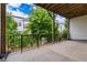 Balcony view with black metal railing and green trees at 2118 Iverson Se Dr, Smyrna, GA 30080