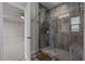 Large walk-in shower featuring glass enclosure and seating area at 2118 Iverson Se Dr, Smyrna, GA 30080