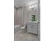 Bathroom with a single sink vanity, bathtub, and tiled floor at 2118 Iverson Se Dr, Smyrna, GA 30080
