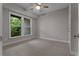Bedroom with a ceiling fan and a large window view at 2118 Iverson Se Dr, Smyrna, GA 30080