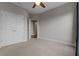 Spacious bedroom with plush carpet, and ample closet space at 2118 Iverson Se Dr, Smyrna, GA 30080