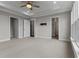 Expansive bedroom boasts ample closet space, neutral colors, and a ceiling fan at 2118 Iverson Se Dr, Smyrna, GA 30080