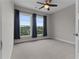 Bright bedroom featuring new carpet, ceiling fan, and a relaxing space at 2118 Iverson Se Dr, Smyrna, GA 30080