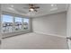 Spacious bedroom with large windows, tray ceiling and a ceiling fan at 2118 Iverson Se Dr, Smyrna, GA 30080