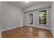 Bedroom with hardwood floors, a double door leading to balcony and large window at 2118 Iverson Se Dr, Smyrna, GA 30080