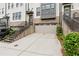 Townhome featuring attached garage with painted garage door and landscaping at 2118 Iverson Se Dr, Smyrna, GA 30080