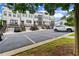 View of the front of the townhomes showcasing ample parking at 2118 Iverson Se Dr, Smyrna, GA 30080
