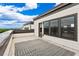 Spacious roof deck features durable gray patterned rug, offering comfortable outdoor living with scenic views at 2118 Iverson Se Dr, Smyrna, GA 30080